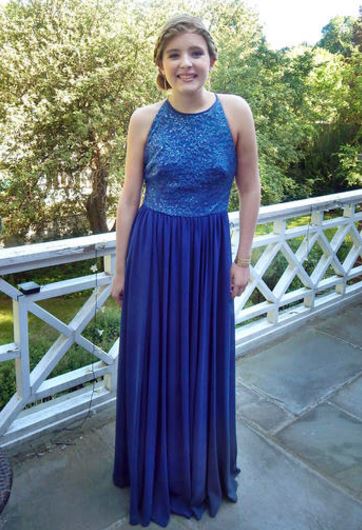 In this May 29, 2015 photo provided by Jennifer Goodwin, Catherine Malatesta poses at her home in Arlington, Mass., before attending the junior prom at Arlington High School. After Catherine died from a rare cancer on Aug. 2, 2015, her friends...