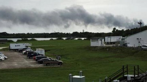 Smoke rises from a SpaceX launch site Thursday, Sept. 1, 2016, at Cape Canaveral, Fla. NASA said SpaceX was conducting a test firing of its unmanned rocket when a blast occurred. (AP Photo/Marcia Dunn)