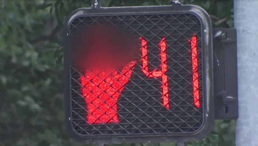 Someone vandalized these crosswalk signs to flip pedestrians the bird_210448