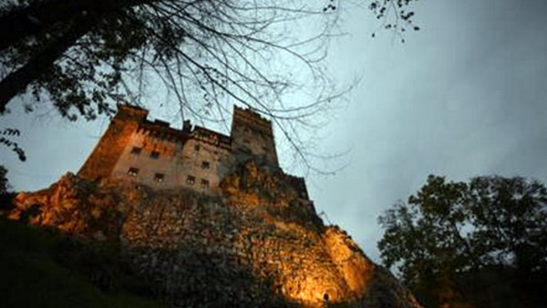 In this picture taken Oct. 9, 2016, Bran Castle lies on top of cliffs in Bran, Romania. Airbnb has launched a contest to find two people to stay overnight in the castle on Halloween, popularly known as Dracula’s castle because of its connection to...