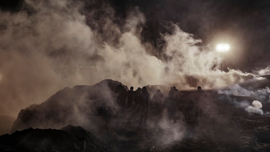 TIJUANA TEAR GAS BORDER PATROL FENCE