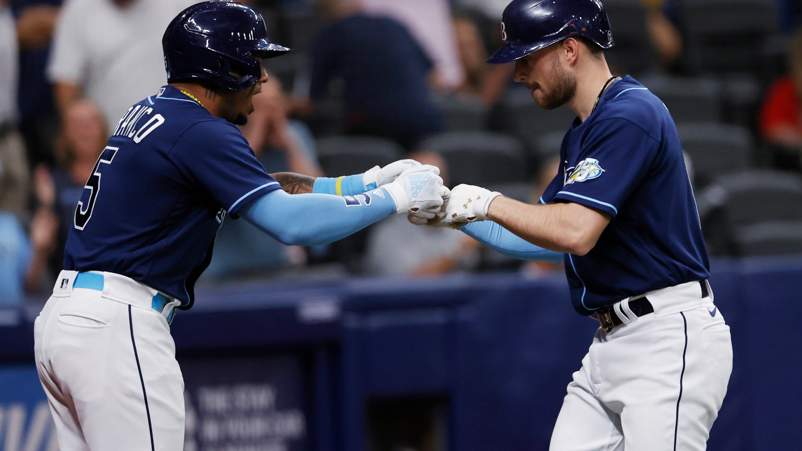 Tampa Bay Rays' Brandon Lowe, right, celebrates with Wander Franco after hitting a home run against the Boston Red Sox during the fifth inning of a baseball game Tuesday, April 11, 2023, in St. Petersburg, Fla. (AP Photo/Scott Audette)