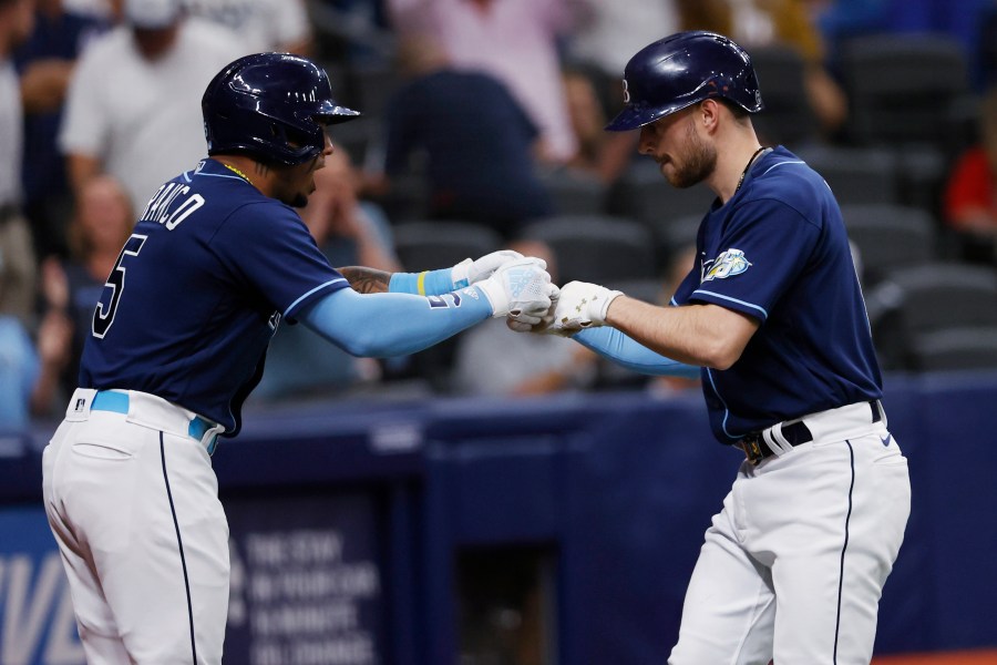 Tampa Bay Rays' Brandon Lowe, right, celebrates with Wander Franco after hitting a home run against the Boston Red Sox during the fifth inning of a baseball game Tuesday, April 11, 2023, in St. Petersburg, Fla. (AP Photo/Scott Audette)