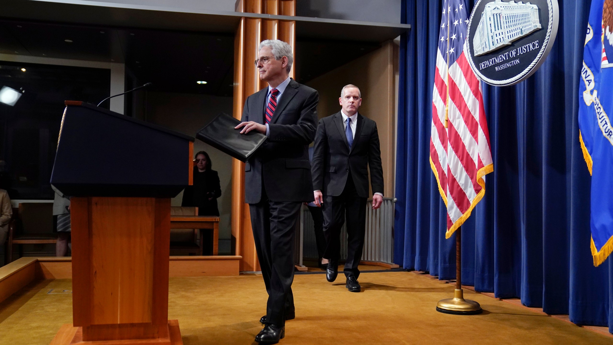 Attorney General Merrick Garland arrives to speak at the Department of Justice in Washington, Thursday, April 13, 2023. Garland announced that a Massachusetts Air National Guard member who has emerged as a main person of interest in the disclosure of highly classified military documents on the Ukraine war was taken into custody Thursday by federal agents. FBI Deputy Director Paul Abbate follows at right. (AP Photo/Evan Vucci)