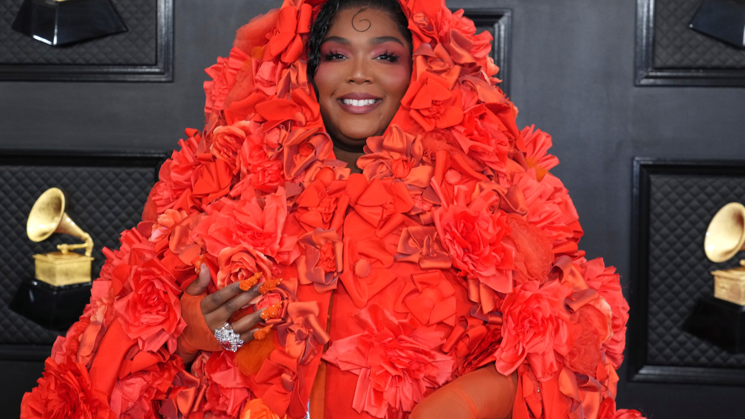 FILE - Lizzo arrives at the 65th annual Grammy Awards on Feb. 5, 2023, in Los Angeles. In a concert Friday, April 21, 2023 in Knoxville, Tenn., Lizzo filled the stage with drag queens in a glittery protest against the state's legislation designed to restrict drag performances in public. (Photo by Jordan Strauss/Invision/AP)