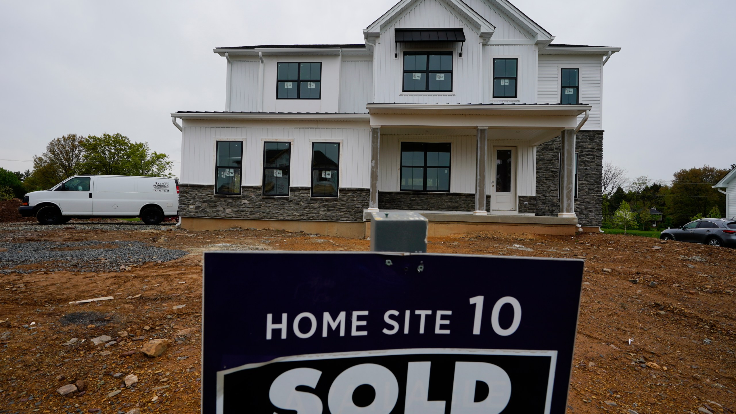 A home under construction at a development in Eagleville, Pa., is shown on Friday, April 28, 2023. Rates on credit cards, mortgages and auto loans, which have been surging since the Fed began raising rates last year, all stand to rise even more. (AP Photo/Matt Rourke)