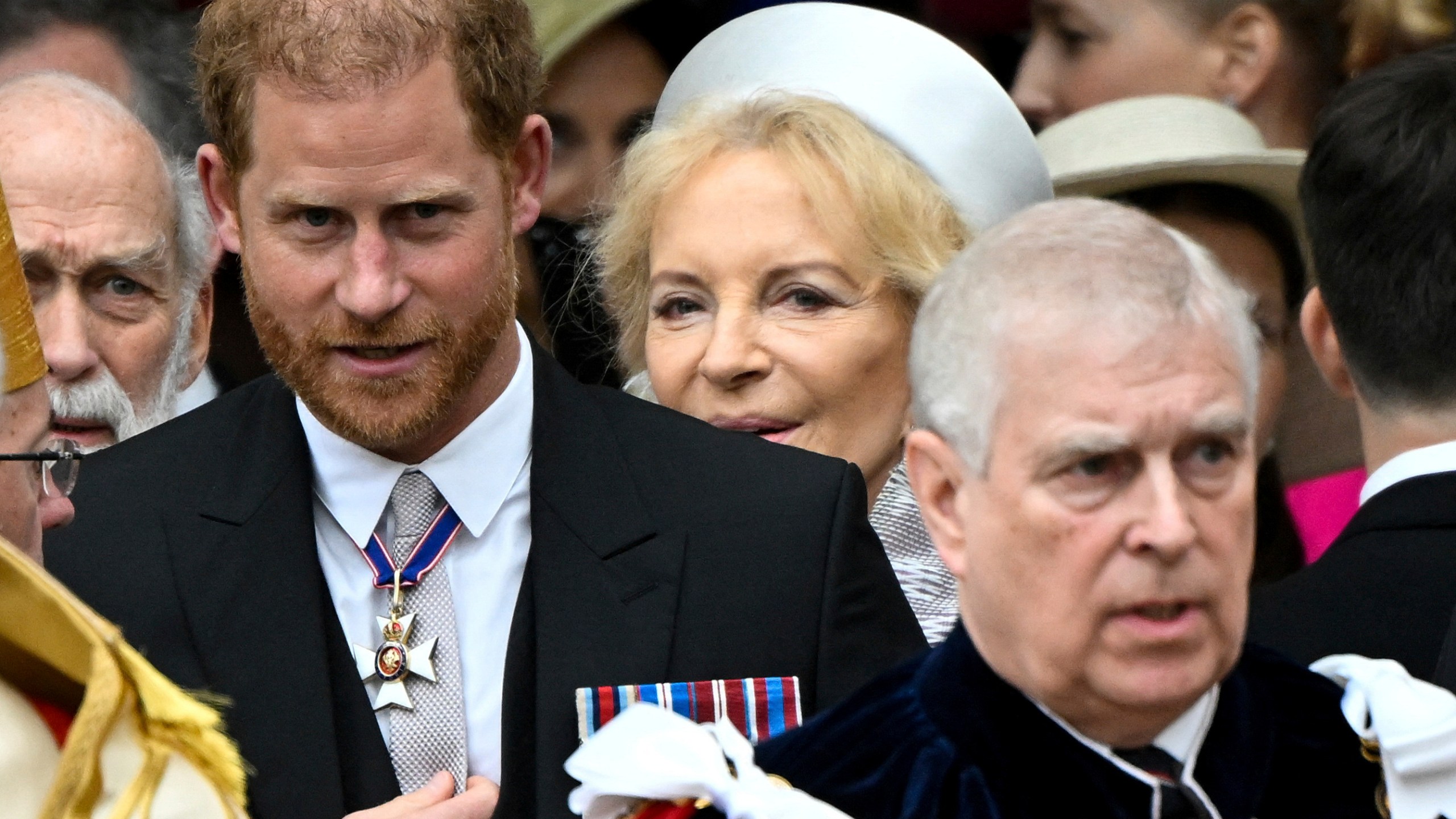 Britain's Prince Harry, Duke of Sussex, and Prince Andrew leave Westminster Abbey following the coronation ceremony of Britain's King Charles and Queen Camilla, in London, Saturday, May 6, 2023. (Toby Melville, Pool via AP)