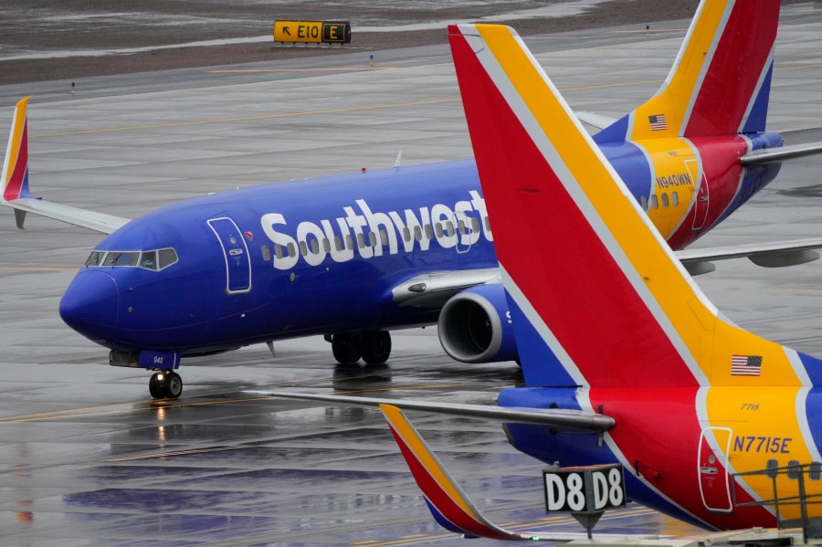 FILE - A Southwest Airlines jet arrives at Sky Harbor International Airport in Phoenix on Dec. 28, 2022. Southwest Airlines will pay a $35 million fine as part of a $140 million agreement to settle a federal investigation into a debacle last December when the airline canceled thousands of flights and stranded more than 2 million travelers over the holidays. (AP Photo/Matt York, File)