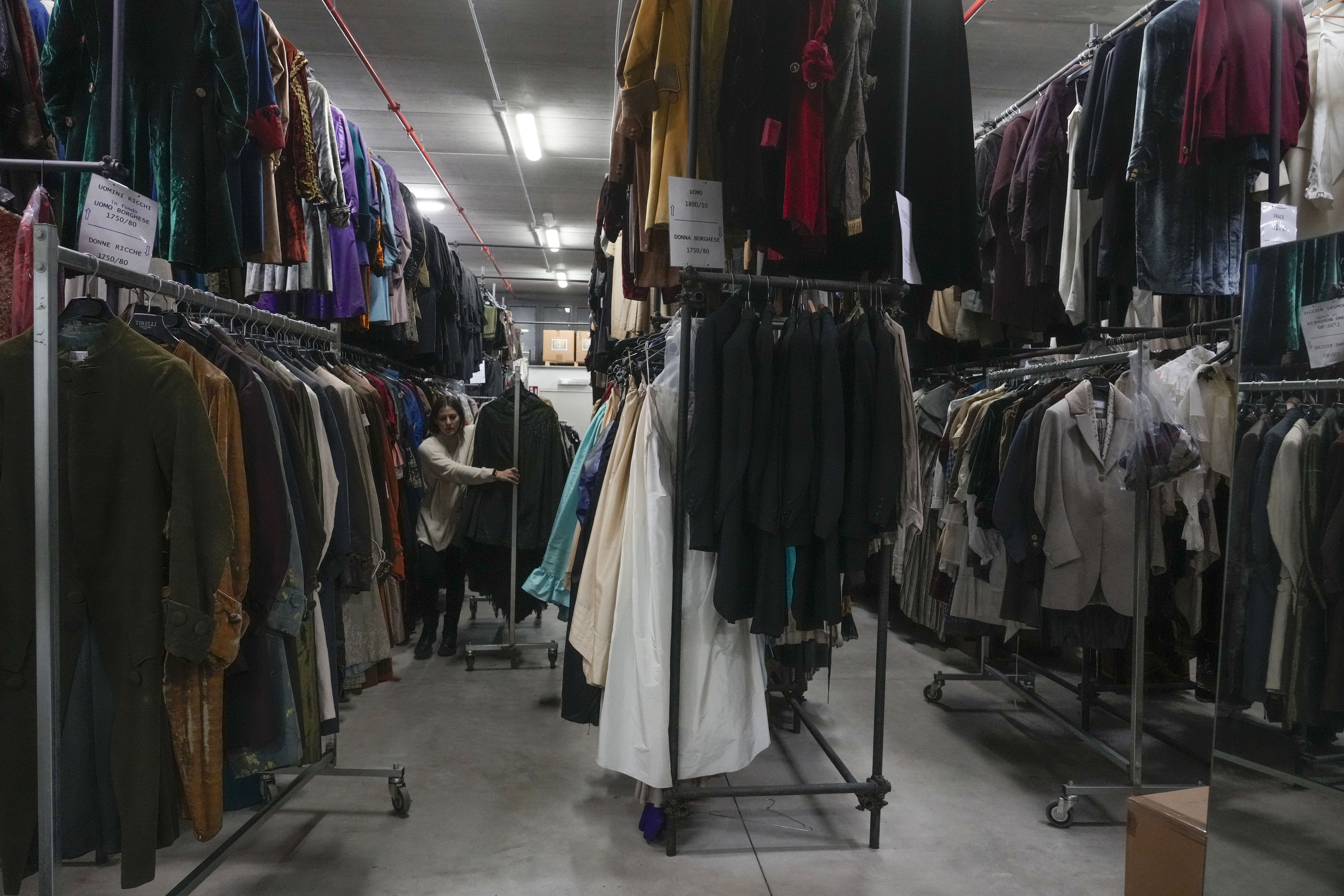 Dresses hang at the Tirelli's warehouse in Formello near Rome, Tuesday, March 5, 2024. For nearly six decades, the Tirelli atelier in Rome has woven itself into the fabric of Italian and international film history, earning the nickname the "Oscar tailor's shop" for its contribution to cinematic costume design. Established in November 1964, the shop on a quiet Roman street has been behind 17 Academy Awards for Best Costume Design. (AP Photo/Gregorio Borgia)