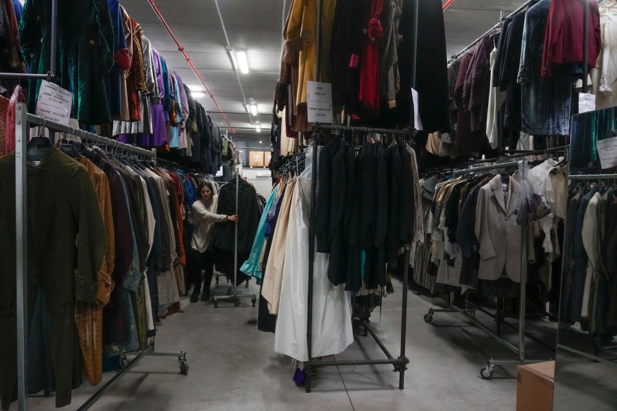 Dresses hang at the Tirelli's warehouse in Formello near Rome, Tuesday, March 5, 2024. For nearly six decades, the Tirelli atelier in Rome has woven itself into the fabric of Italian and international film history, earning the nickname the "Oscar tailor's shop" for its contribution to cinematic costume design. Established in November 1964, the shop on a quiet Roman street has been behind 17 Academy Awards for Best Costume Design. (AP Photo/Gregorio Borgia)