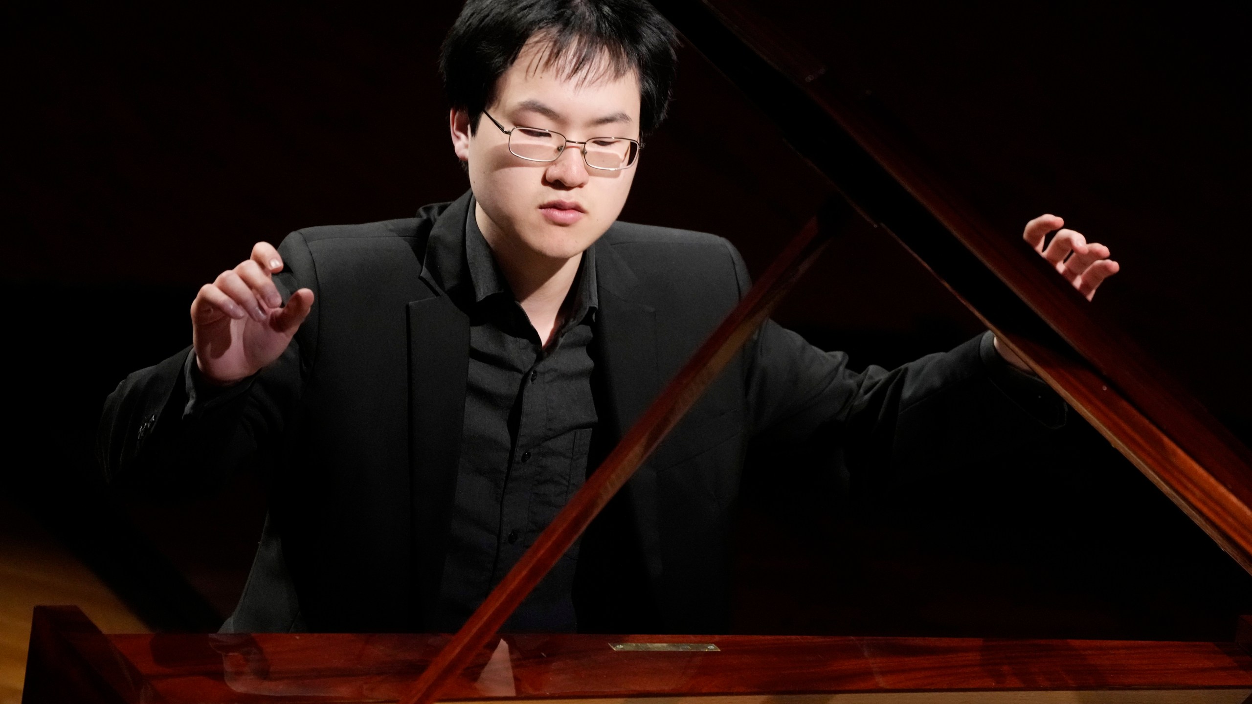 Canadian pianist Eric Guo plays Frederic Chopin's Concerto in F minor on a replica of a 1830 Pleyel piano during a concert marking the 19th century piano virutoso and composer's 214th birthday, in Warsaw, Poland, on Friday, March 1, 2024. Guo won a quintannual competition to play Chopin on period instruments organized by the Fryderyk Chopin Institute. (AP Photo/Czarek Sokolowski)