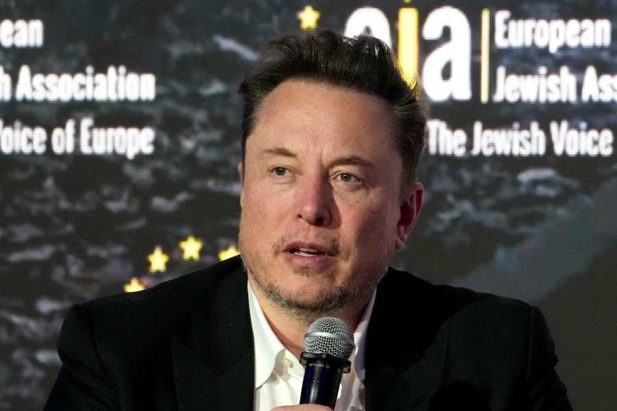 FILE - Elon Musk addresses the European Jewish Association's conference, in Krakow, Poland, Monday, Jan. 22, 2024. Musk is suing OpenAI and its CEO Sam Altman, Thursday, Feb. 29, over what he says is a betrayal of the ChatGPT maker's founding aims of benefiting humanity rather than pursuing profits. (AP Photo/Czarek Sokolowski, File)