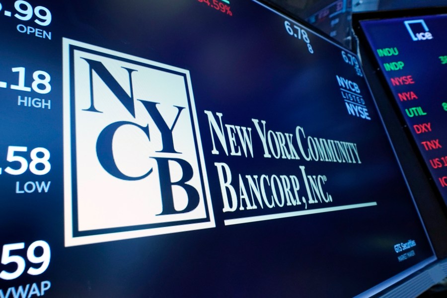 FILE - The logo for New York Community Bancorp is displayed above a trading post on the floor of the New York Stock Exchange, Jan. 31, 2024. New York Community Bancorp's stock plunged even more Wednesday, March 6, 2024 sending it below $2 and down more than 80% for the year so far. (AP Photo/Richard Drew, File)