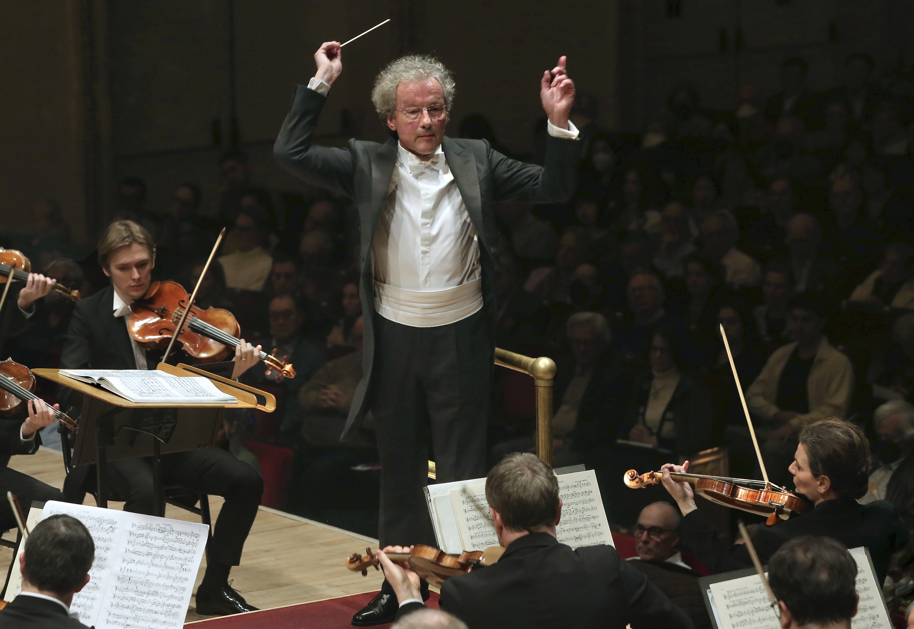 This image released by Carnegie Hall shows conductor Franz Welser-Möst , center, and Albena Danailova, background right, during a performance by the Vienna Philharmonic at Carnegie Hall in New York on March 3, 2024. Vienna Philharmonic has 24 female players among 145 members with three vacancies as it tours the United States this week. (Steve J. Sherman/Carnegie Hall via AP)