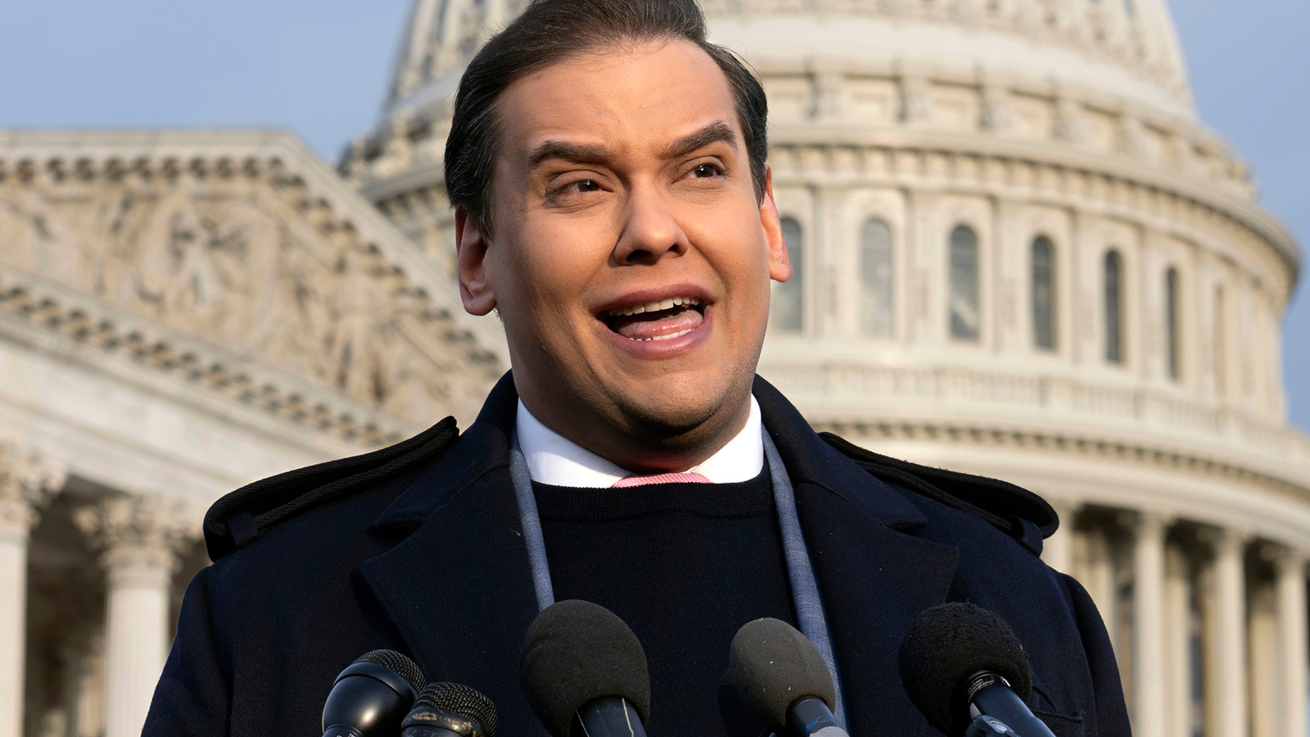 FILE - Rep. George Santos, R-N.Y., faces reporters at the Capitol, Nov. 30, 2023, in Washington. A Texas man was arrested Wednesday, March 6, 2024, on accusations he schemed to dupe George Santos into wiring him money with the false promise that he could get the criminal corruption charges against the disgraced congressman dropped. (AP Photo/J. Scott Applewhite, File)