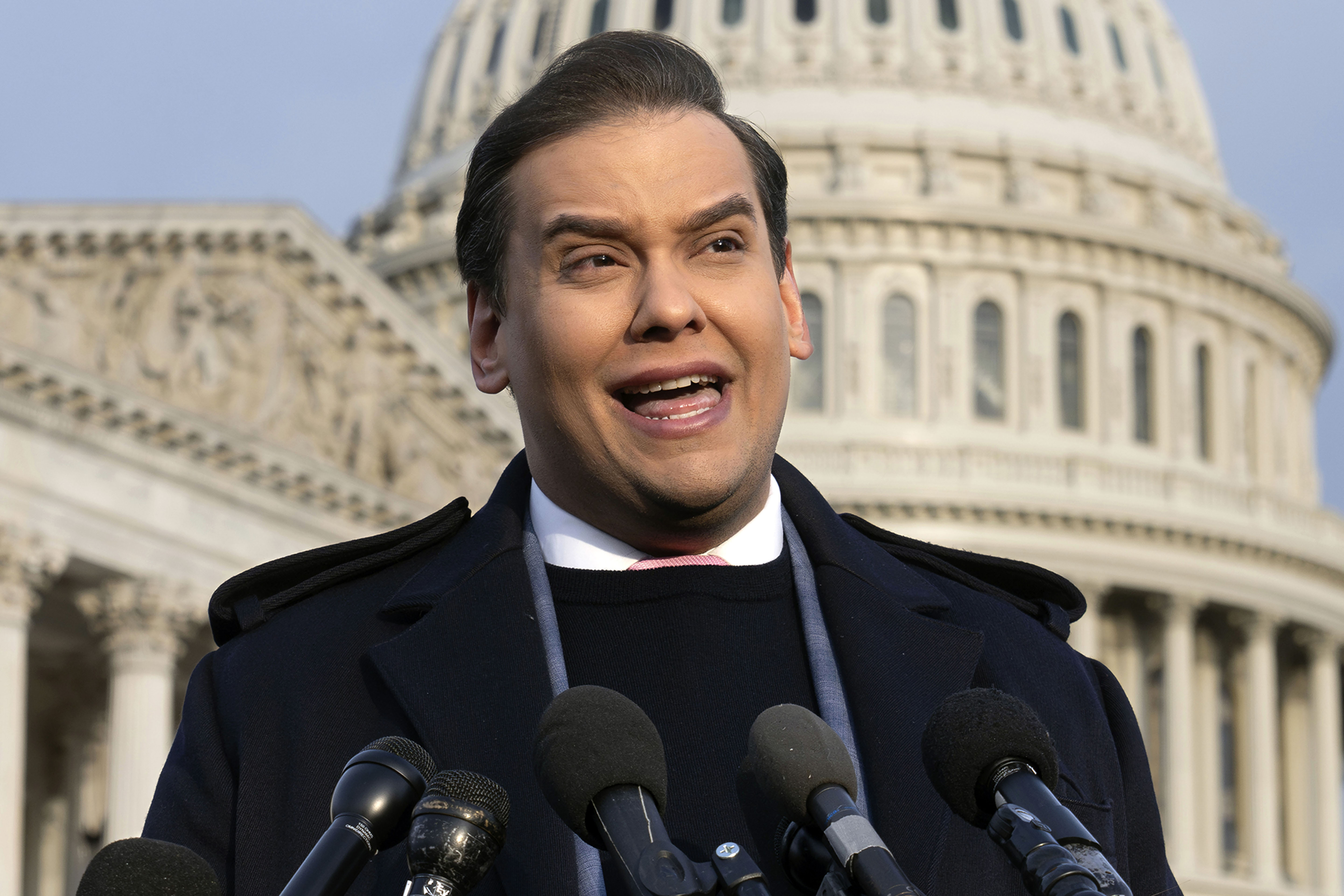 FILE - Rep. George Santos, R-N.Y., faces reporters at the Capitol, Nov. 30, 2023, in Washington. A Texas man was arrested Wednesday, March 6, 2024, on accusations he schemed to dupe George Santos into wiring him money with the false promise that he could get the criminal corruption charges against the disgraced congressman dropped. (AP Photo/J. Scott Applewhite, File)