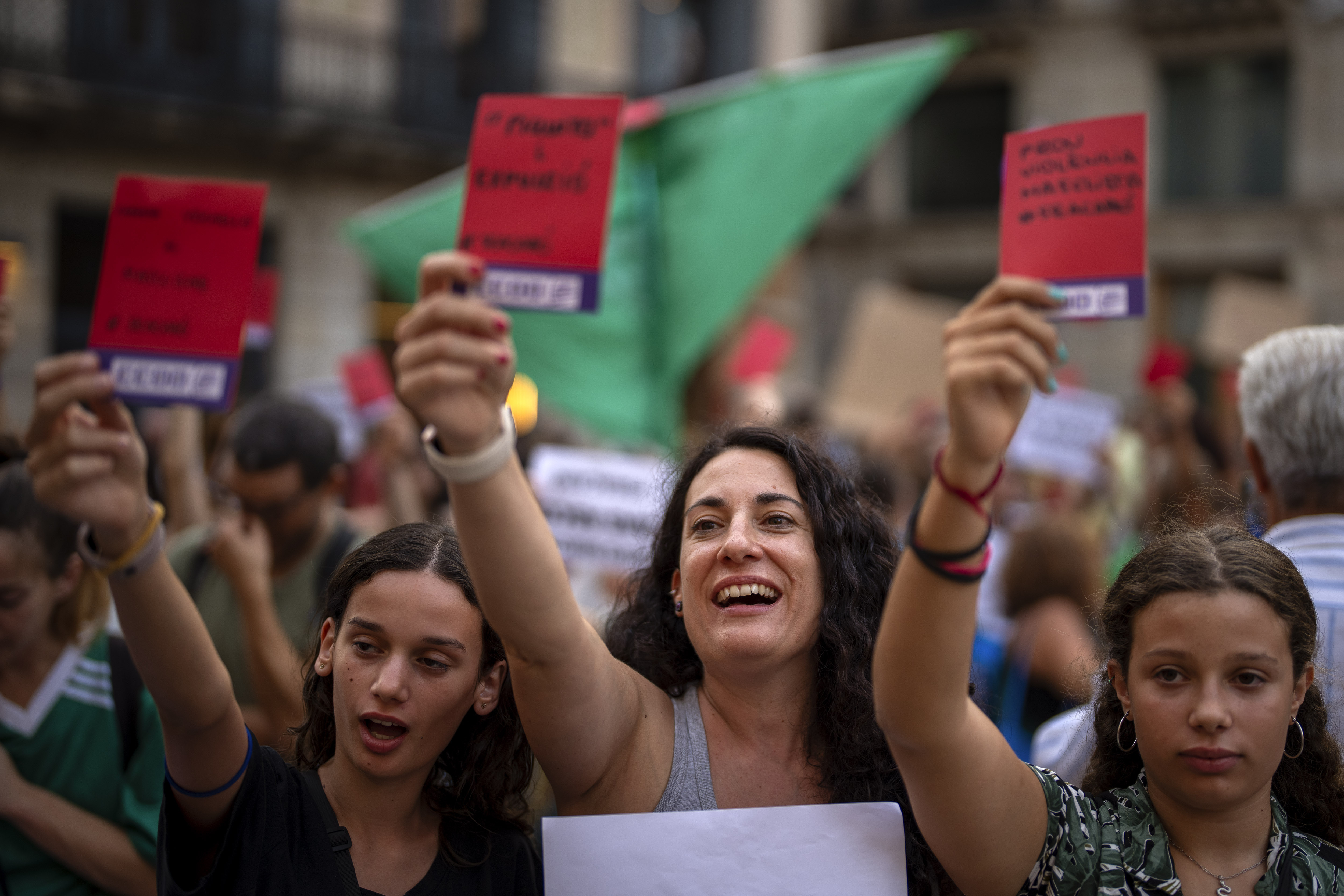 FILE - Demonstrators shouts slogans during a protest against the President of Spain's soccer federation Luis Rubiales and to support Spain's national women's soccer player Jenni Hermoso in Barcelona, Spain, Monday, Sept. 4, 2023. The Spanish soccer federation and Barcelona soccer club have been fined an undisclosed sum by Spain’s labor ministry for not meeting workplace regulations regarding gender equality. The ministry says that the federation did not have the required gender equality plan or sexual harassment protocols in place when Spain won last year's Women's World Cup. (AP Photo/Emilio Morenatti, File)